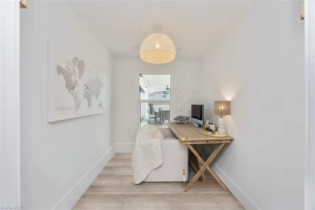 a workspace with furniture and window