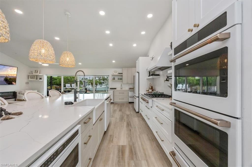 1570 Bonita Lane Naples, FL 34102 - Photo 3 of 22 a large kitchen with stainless steel appliances a large counter top