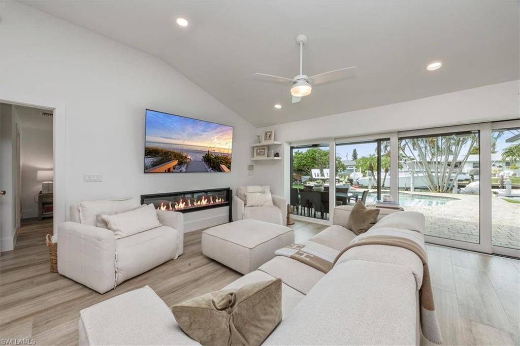 1570 Bonita Lane Naples, FL 34102 - Photo 6 of 22 a living room with furniture and a large window