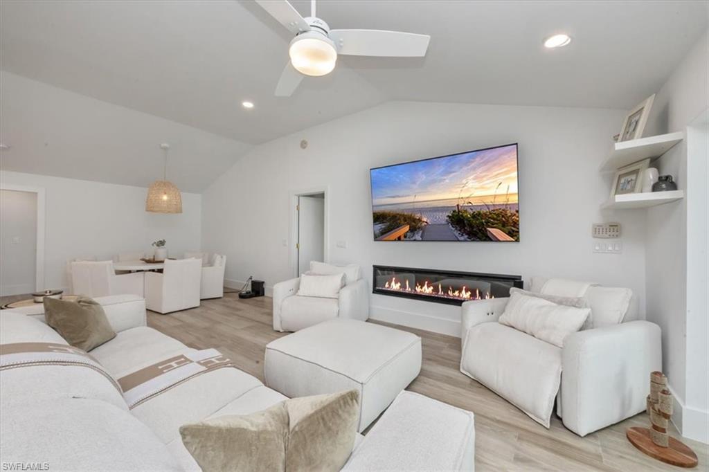 1570 Bonita Lane Naples, FL 34102 - Photo 7 of 22 a living room with furniture and a flat screen tv