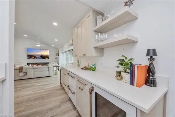 a kitchen with stainless steel appliances sink and cabinets