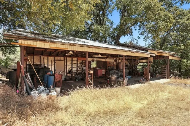 a view of a garage with a white car parked