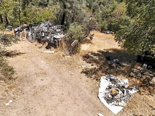 a wooden fence with some trees in the background