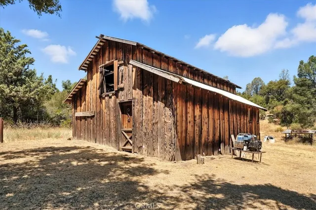 a view of a house with wooden fence