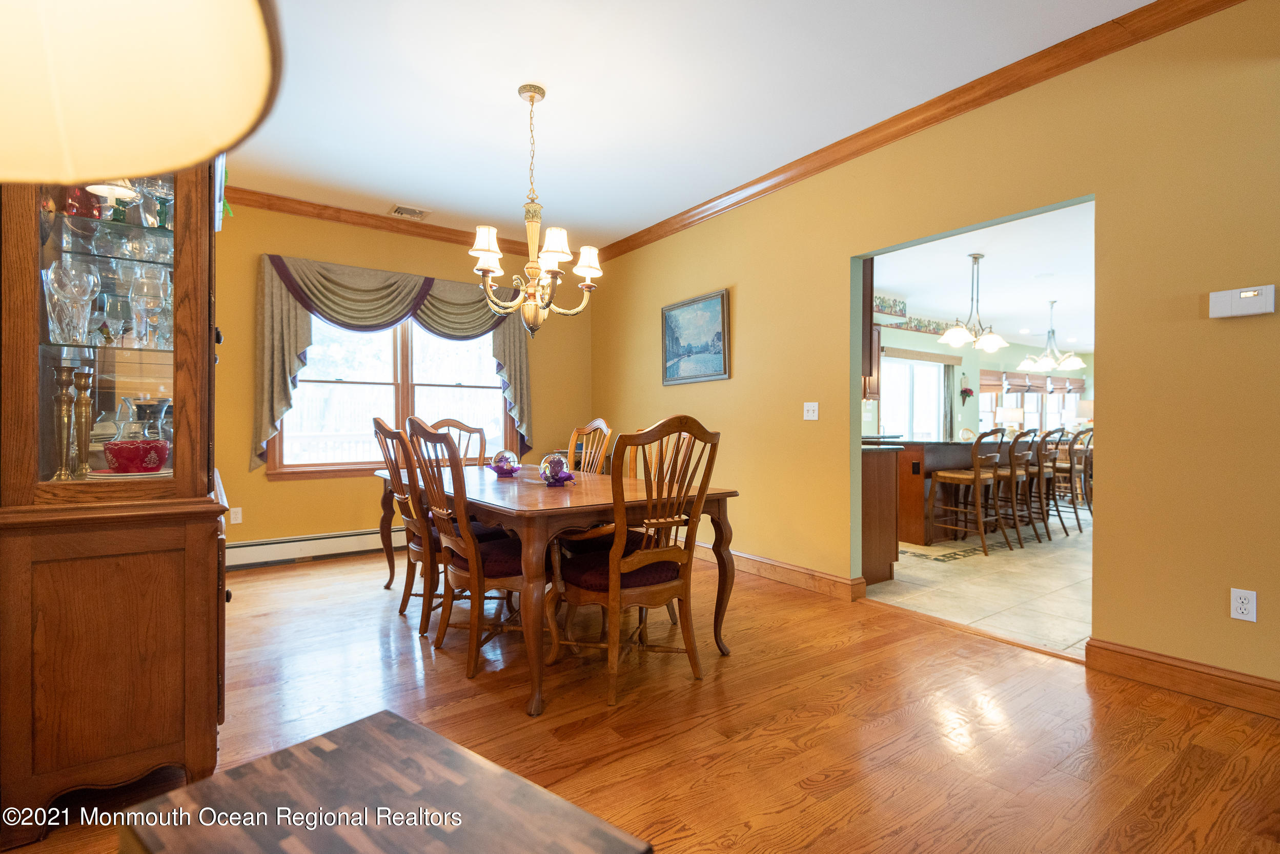 2100 Red Gate Road Allenwood, NJ 08720 - Photo 15 of 61 a view of a dining room with furniture and chandelier