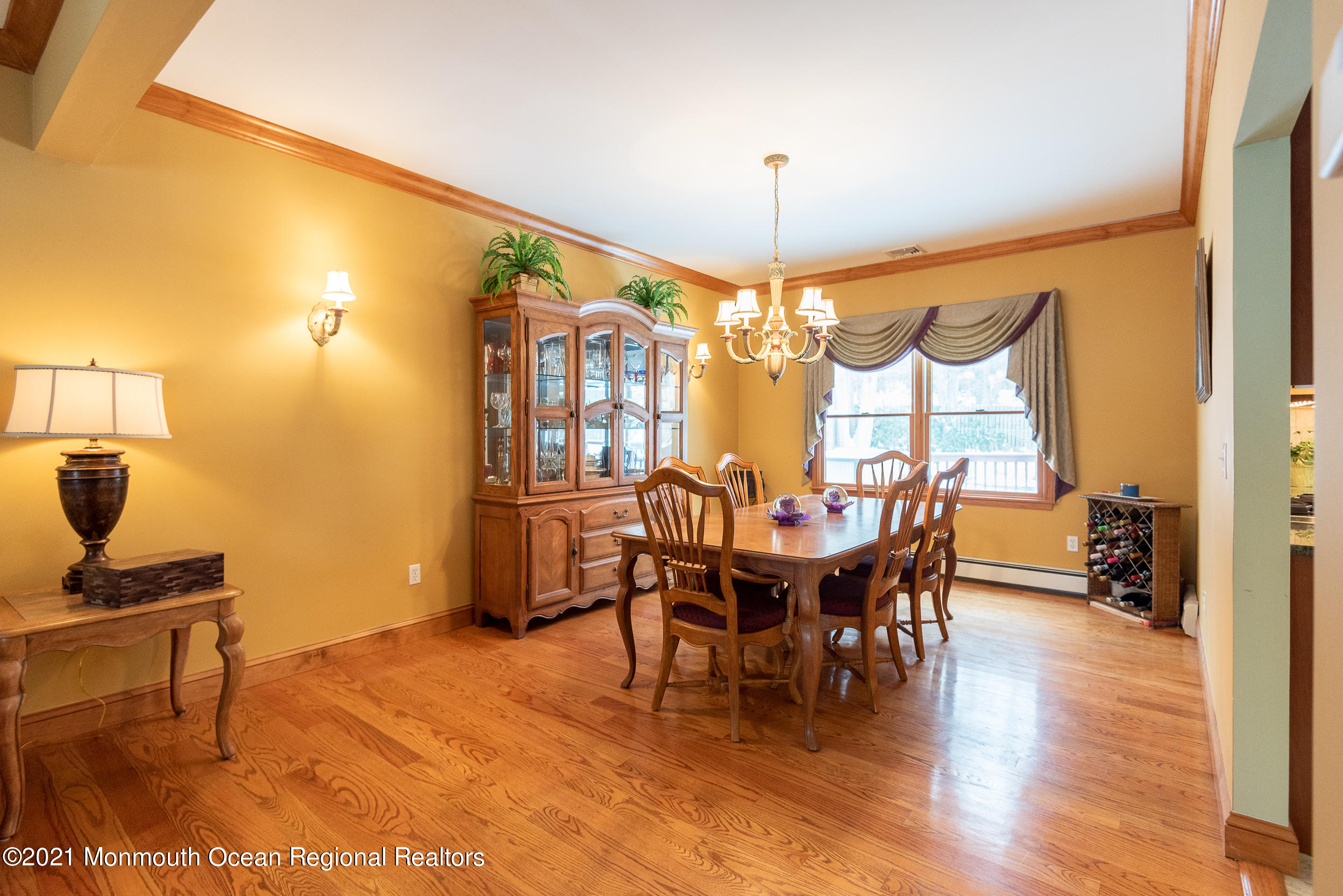 2100 Red Gate Road Allenwood, NJ 08720 - Photo 16 of 61 a view of a dining room with furniture and chandelier