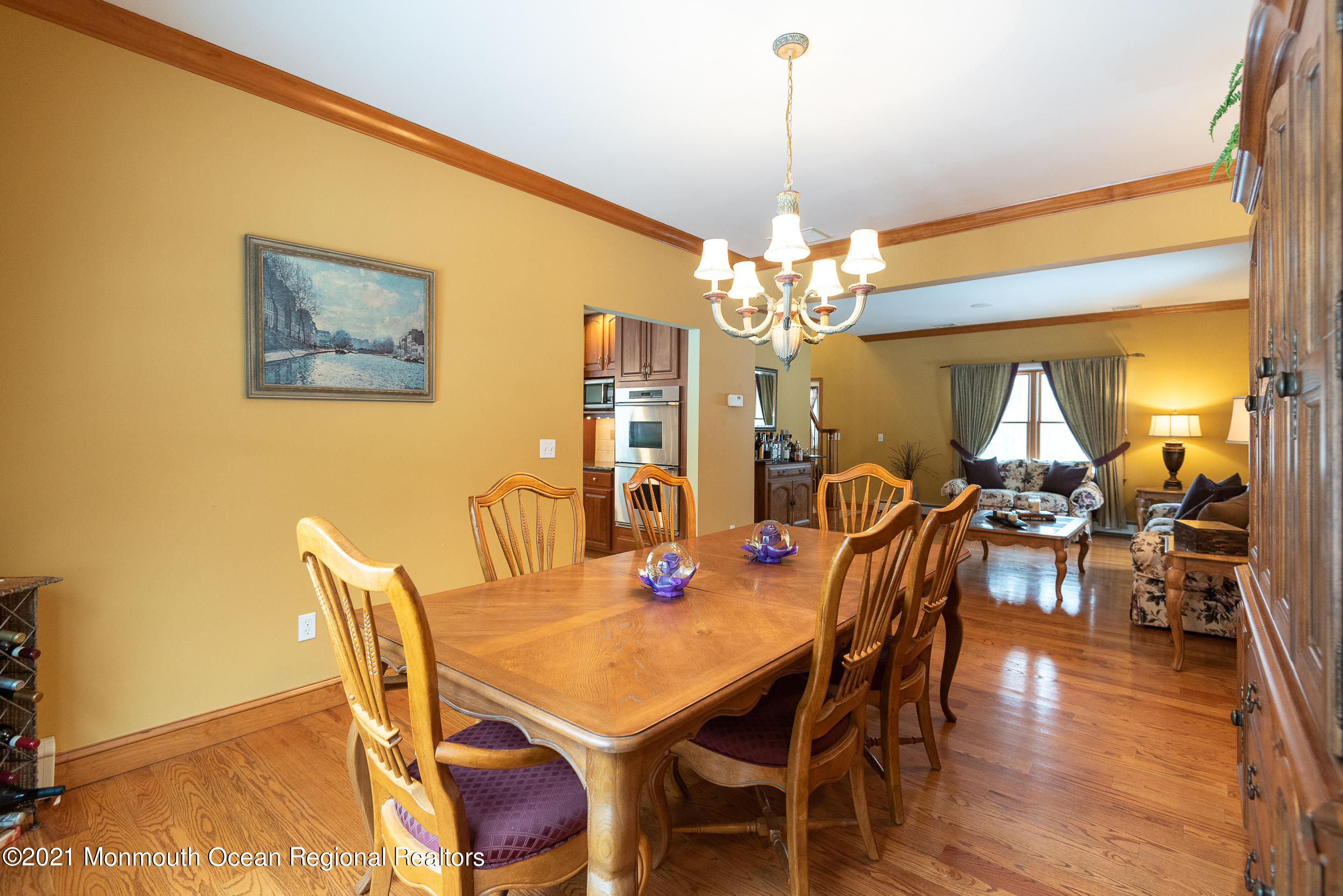 2100 Red Gate Road Allenwood, NJ 08720 - Photo 17 of 61 a view of a dining room with furniture and wooden floor