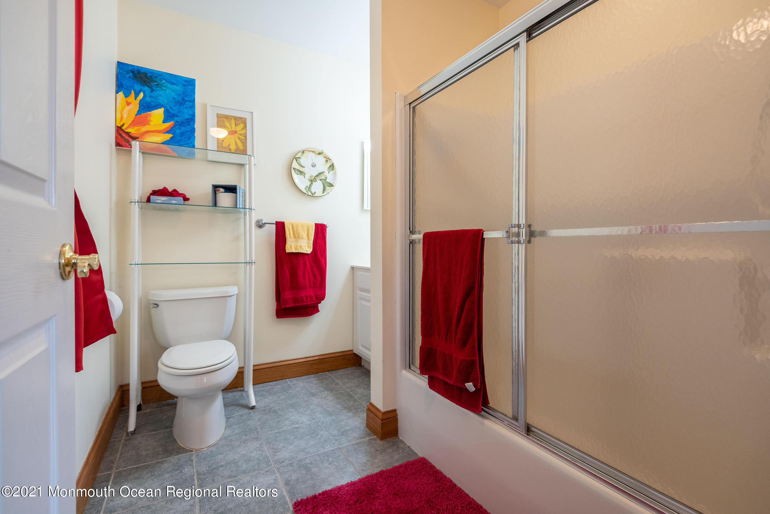 2100 Red Gate Road Allenwood, NJ 08720 - Photo 22 of 61 a bathroom with a toilet and a shower curtain