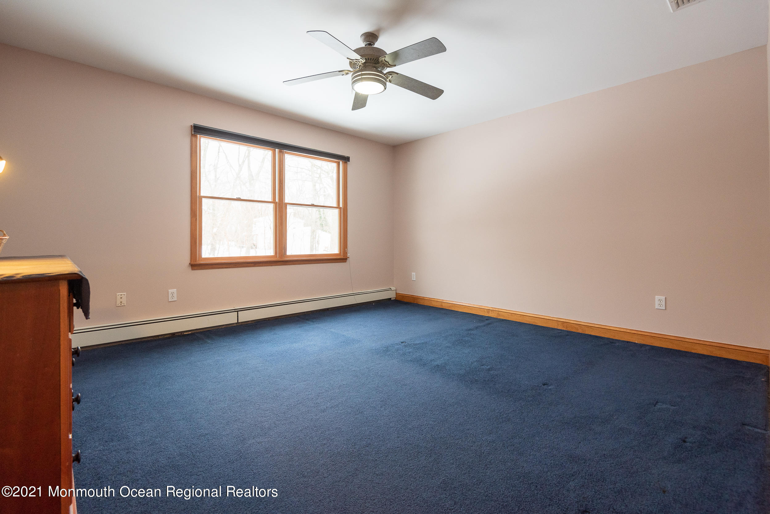 2100 Red Gate Road Allenwood, NJ 08720 - Photo 27 of 61 an empty room with a window and a ceiling fan