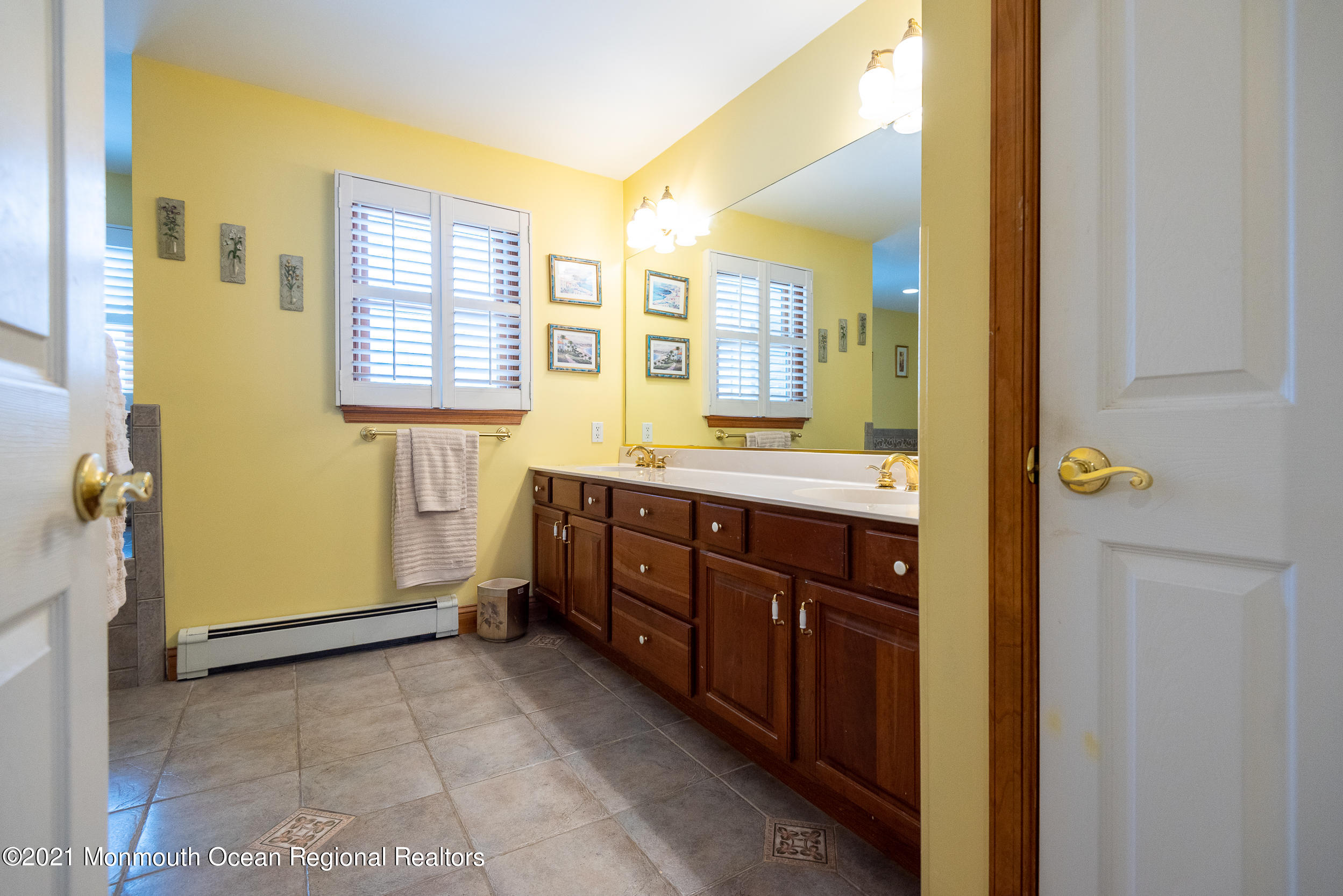 2100 Red Gate Road Allenwood, NJ 08720 - Photo 33 of 61 a spacious bathroom with a granite countertop double vanity and a mirror
