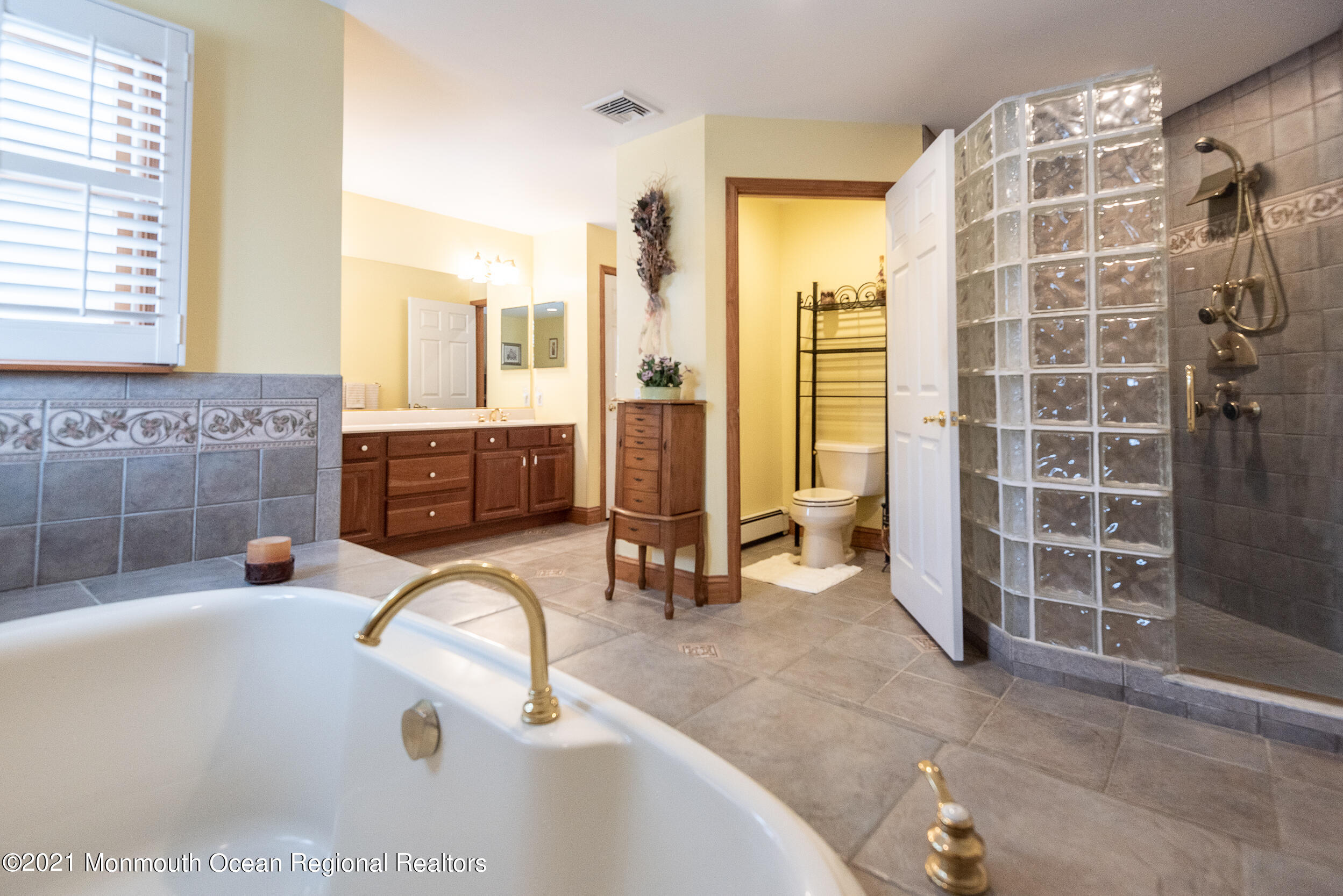 2100 Red Gate Road Allenwood, NJ 08720 - Photo 35 of 61 a bathroom with a tub sink and glass door