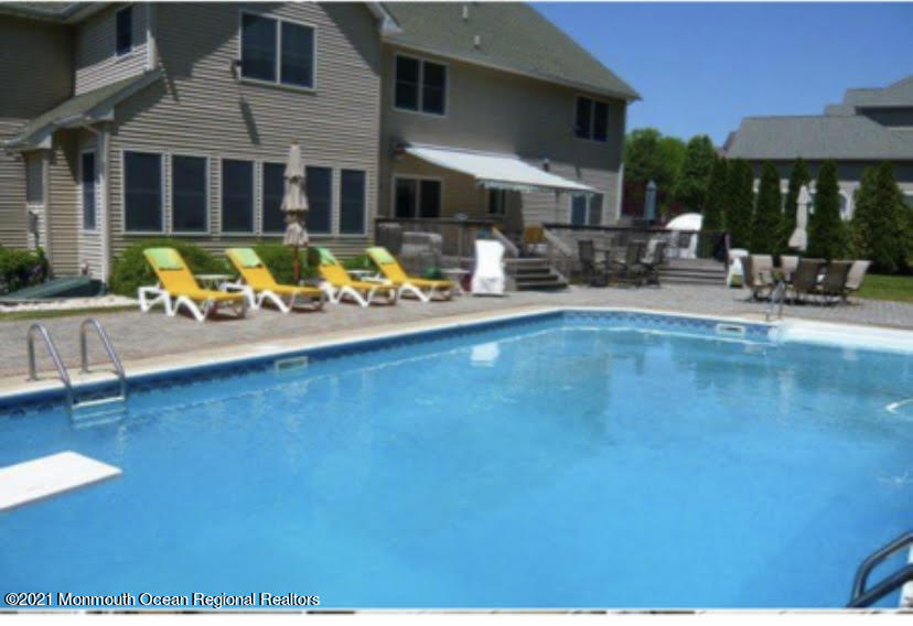 2100 Red Gate Road Allenwood, NJ 08720 - Photo 43 of 61 a view of a swimming pool with outdoor seating