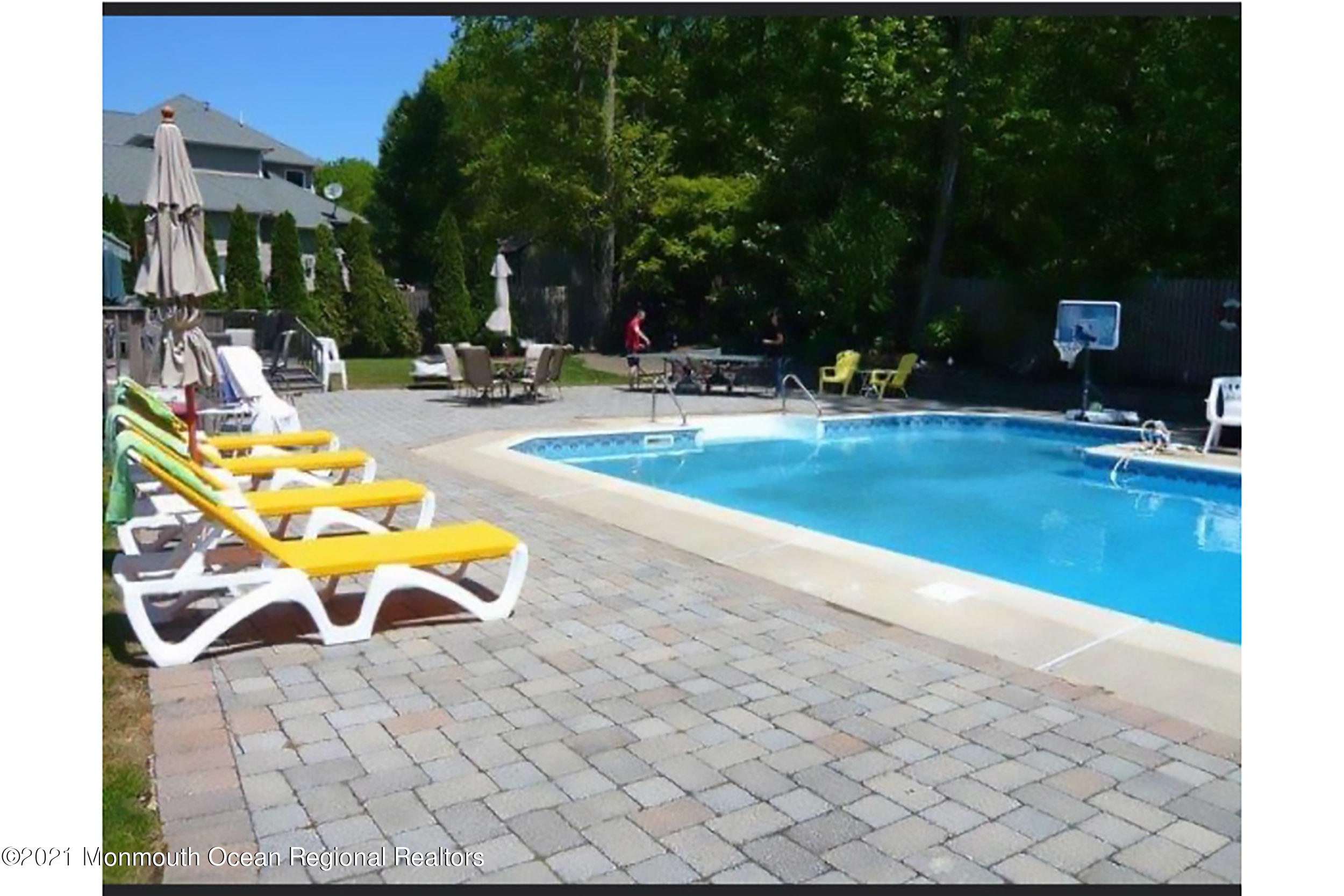 2100 Red Gate Road Allenwood, NJ 08720 - Photo 51 of 61 a swimming pool with outdoor seating and yard