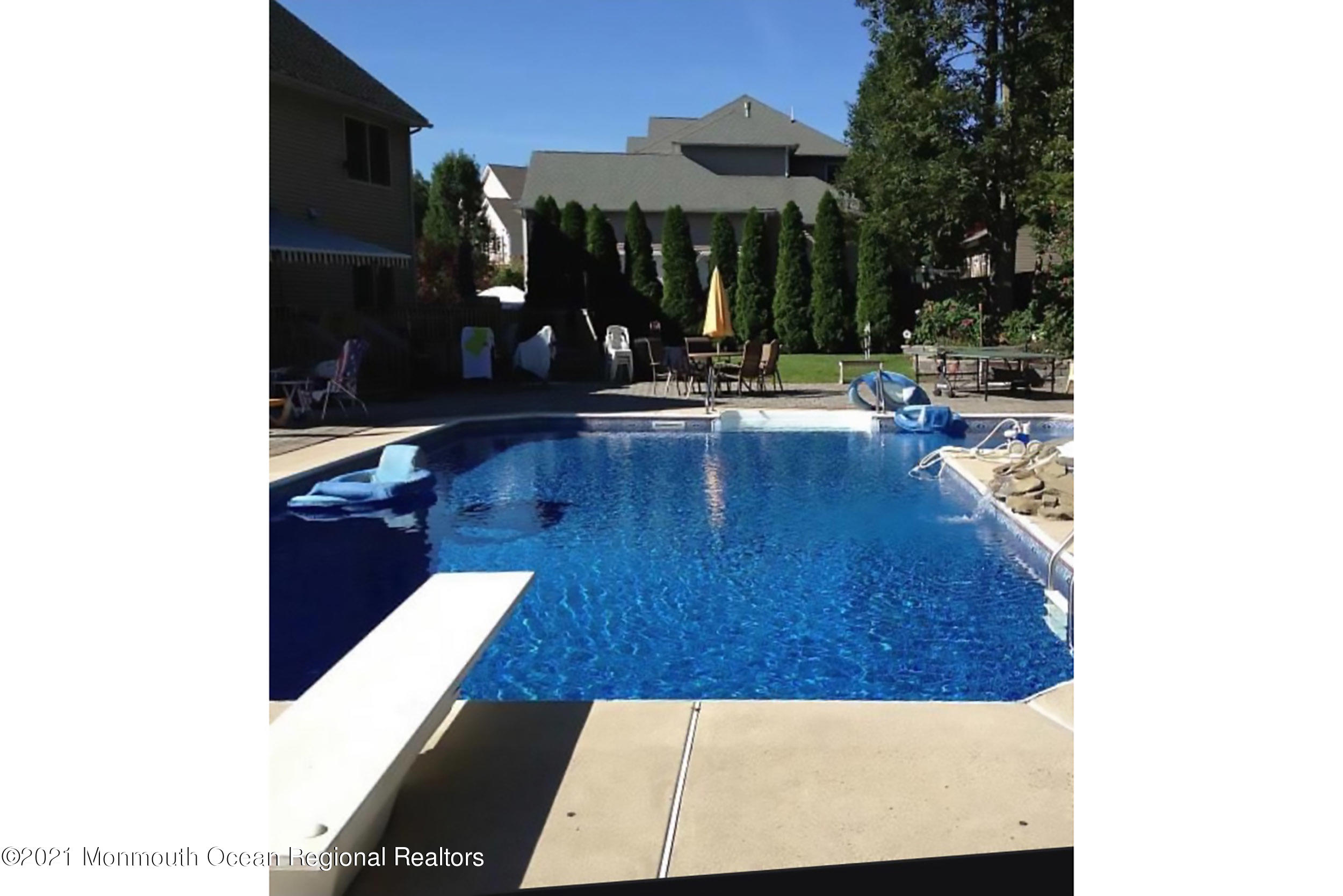 2100 Red Gate Road Allenwood, NJ 08720 - Photo 53 of 61 a view of swimming pool with outdoor seating and a potted plant