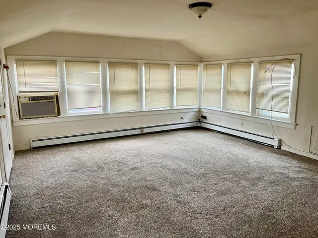 an empty room with a fireplace