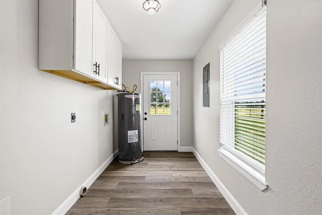 a view of a hallway view with wooden floor and staircase