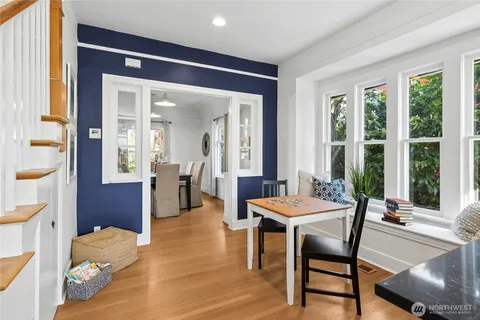a dining room with furniture and window