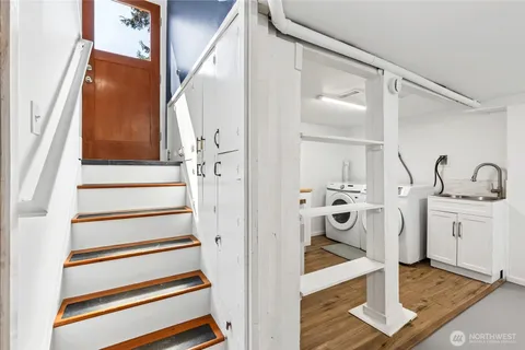 a view of a bathroom with a sink and mirror