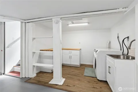 a kitchen with a refrigerator and a sink