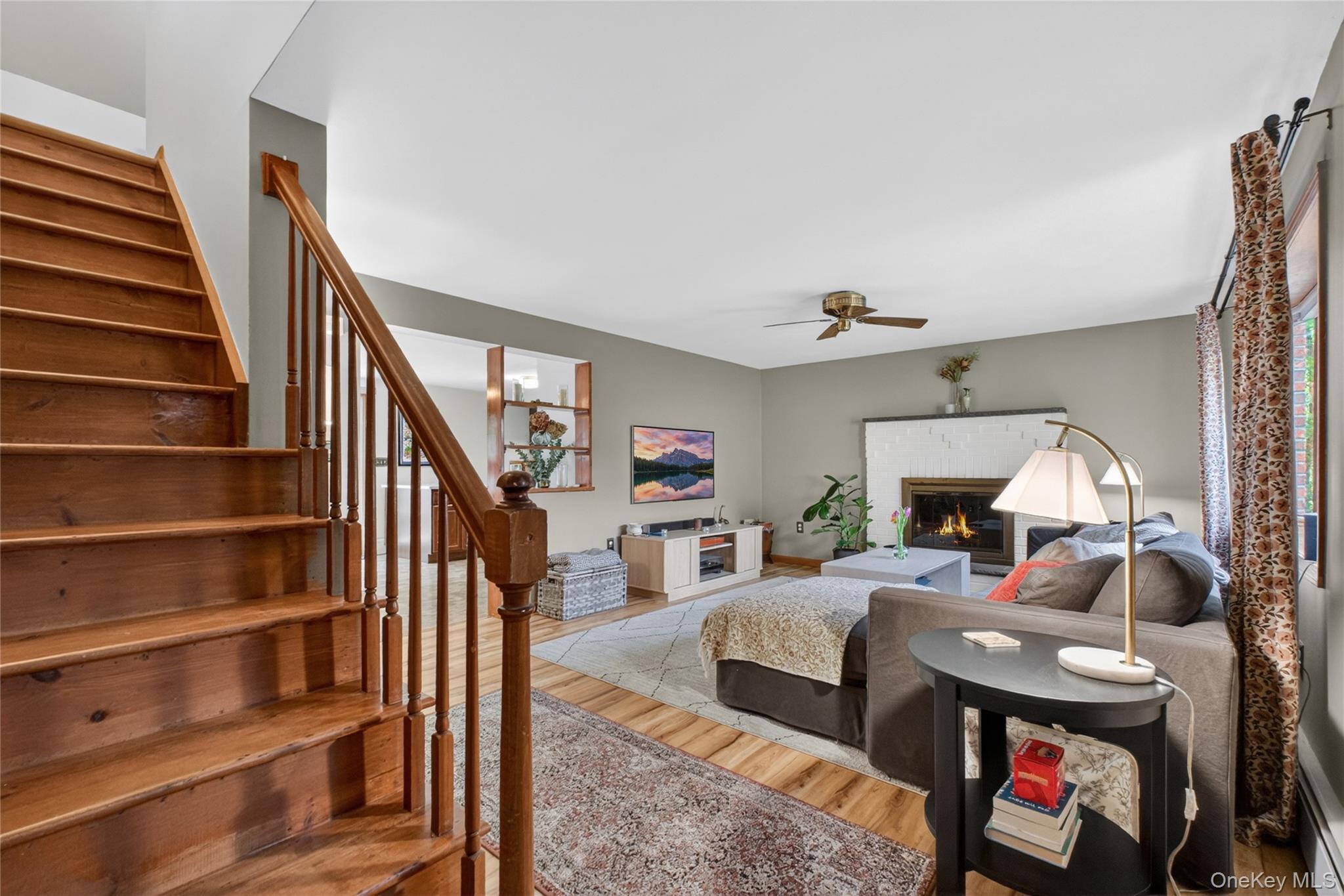 127 Belvedere Road Beacon, NY 12508 - Photo 15 of 37 a living room with furniture a fireplace and a flat screen tv