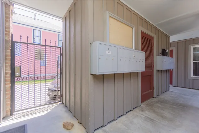 a view of a closet area with staircase