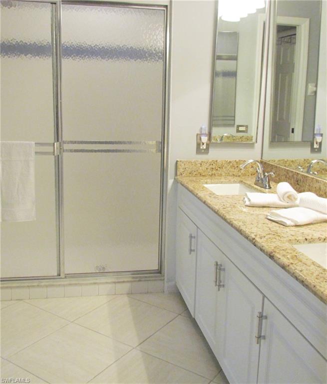 9124 Morris Road Fort Myers, FL 33967 - Photo 19 of 29 a bathroom with a granite countertop sink and a mirror