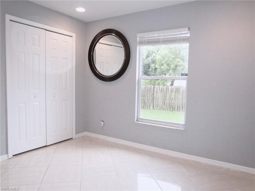 9124 Morris Road Fort Myers, FL 33967 - Photo 22 of 29 an empty room with a window