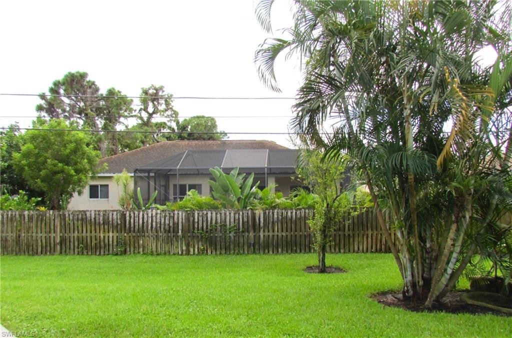 9124 Morris Road Fort Myers, FL 33967 - Photo 28 of 29 a garden with trees in front of it