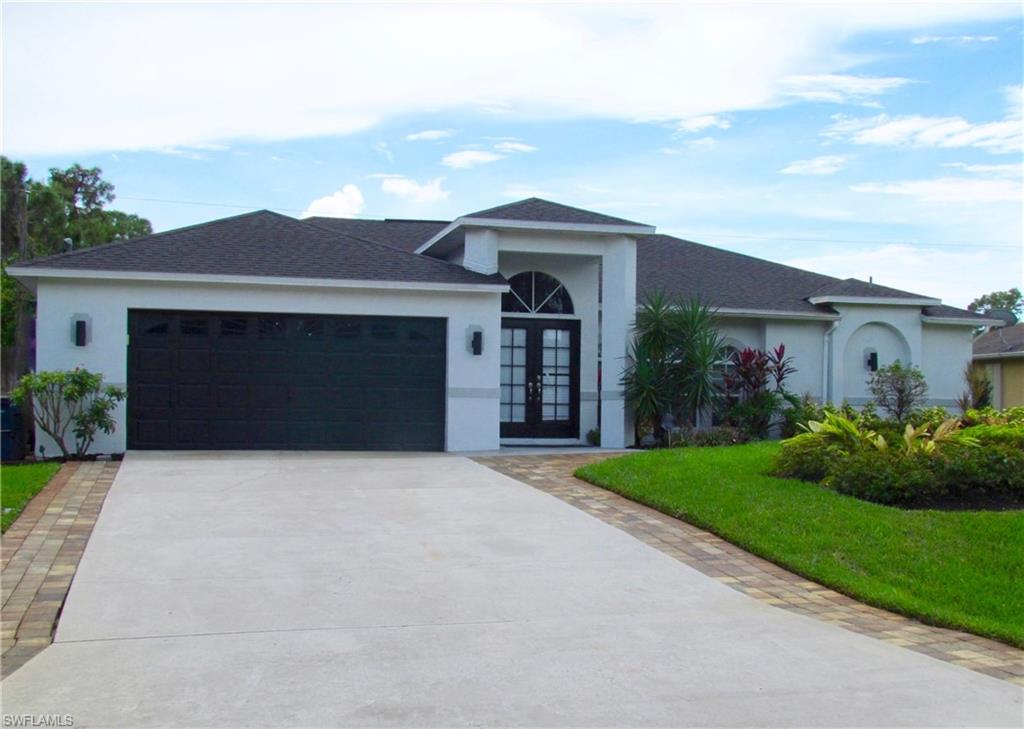 9124 Morris Road Fort Myers, FL 33967 - Photo 4 of 29 a front view of a house with garden