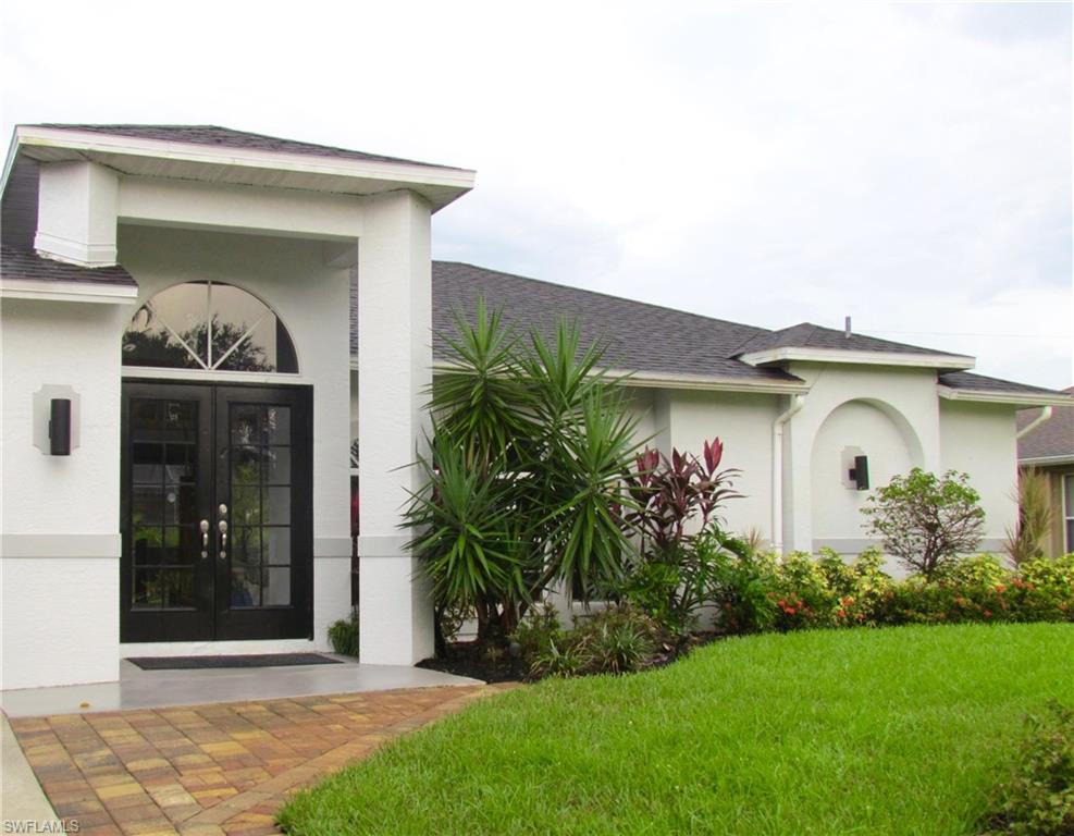 9124 Morris Road Fort Myers, FL 33967 - Photo 5 of 29 a front view of a house with garden