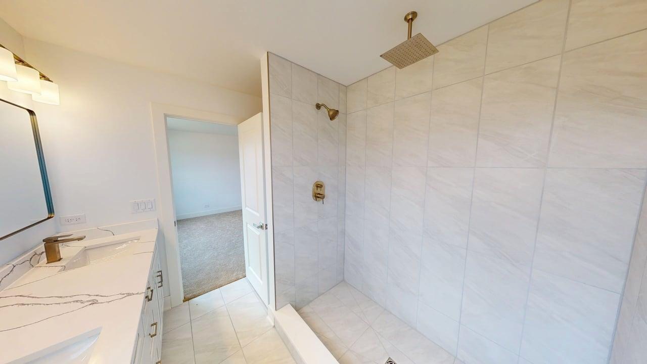 784 Cascade Place Marengo, IL 60152 - Photo 21 of 33 a bathroom with a sink and shower