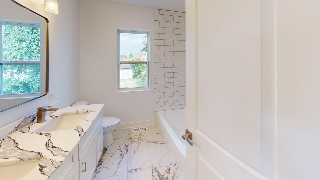 784 Cascade Place Marengo, IL 60152 - Photo 28 of 33 a bath room with a bed and a window