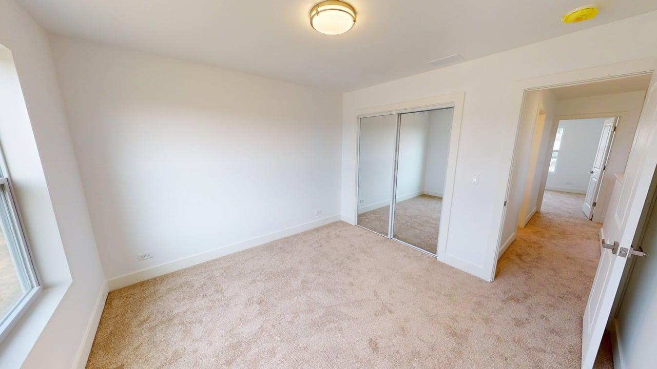 784 Cascade Place Marengo, IL 60152 - Photo 31 of 33 an empty room with wooden floor and windows