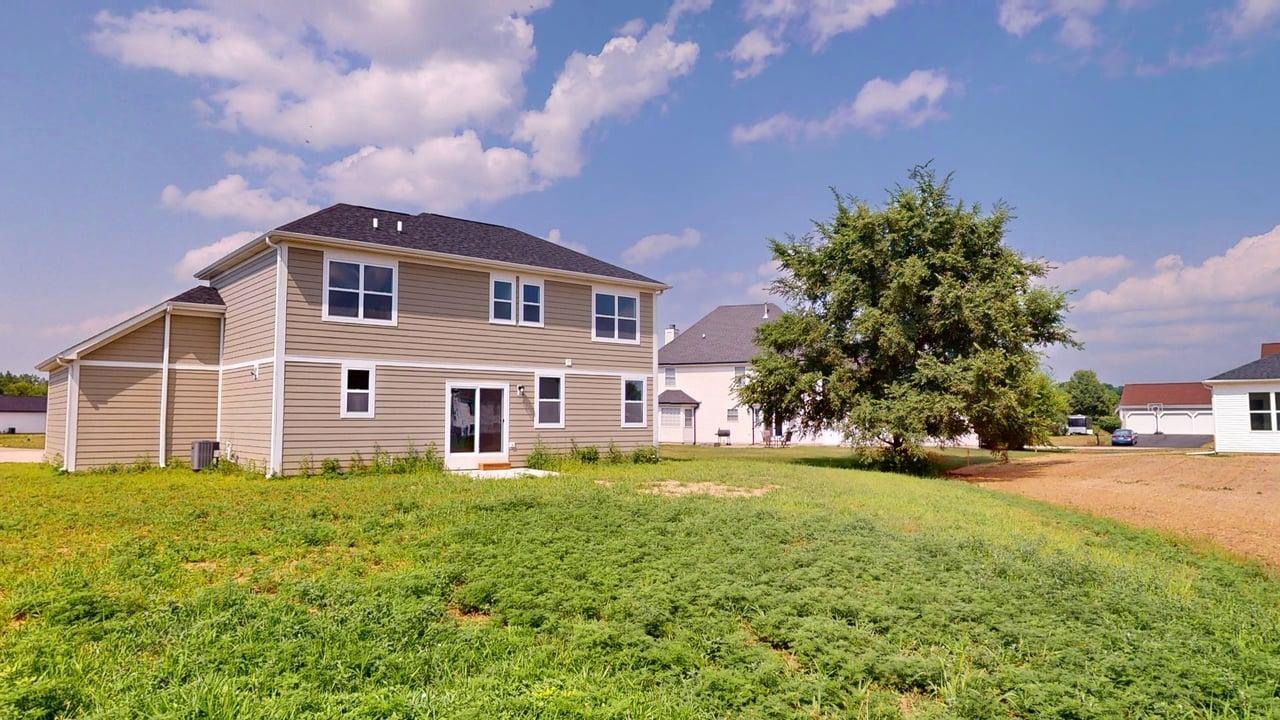 784 Cascade Place Marengo, IL 60152 - Photo 32 of 33 a front view of a house with a yard