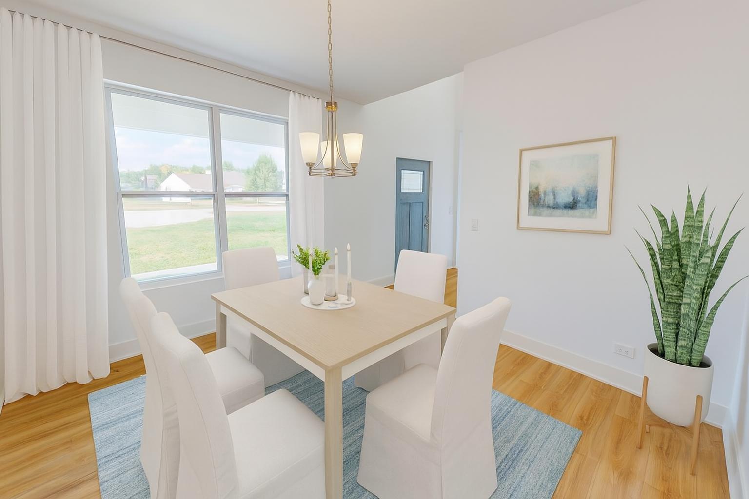 784 Cascade Place Marengo, IL 60152 - Photo 4 of 33 a view of a dining room with furniture window and wooden floor