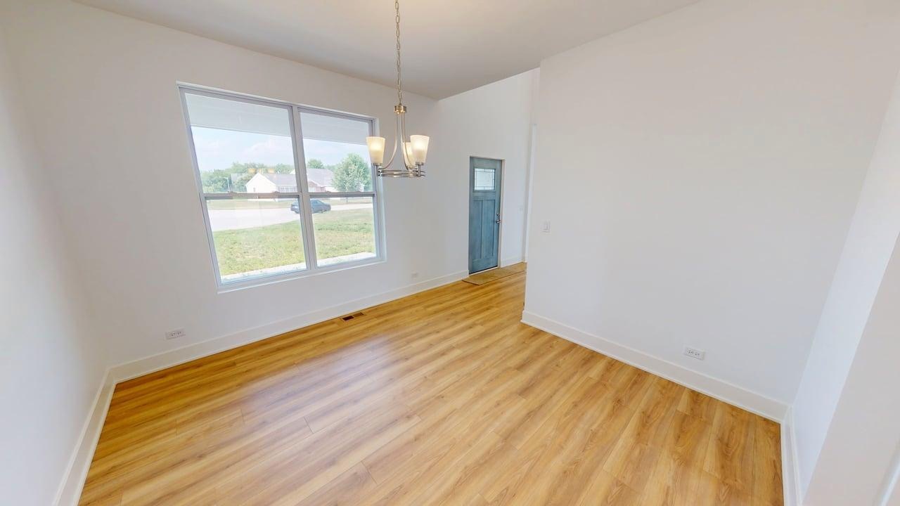 784 Cascade Place Marengo, IL 60152 - Photo 5 of 33 a view of an empty room with a window