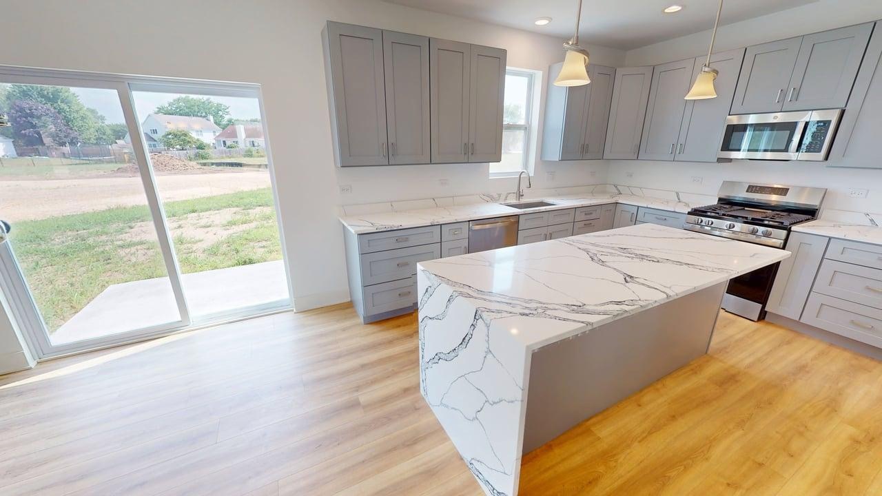 784 Cascade Place Marengo, IL 60152 - Photo 8 of 33 a kitchen with a stove a sink and a microwave