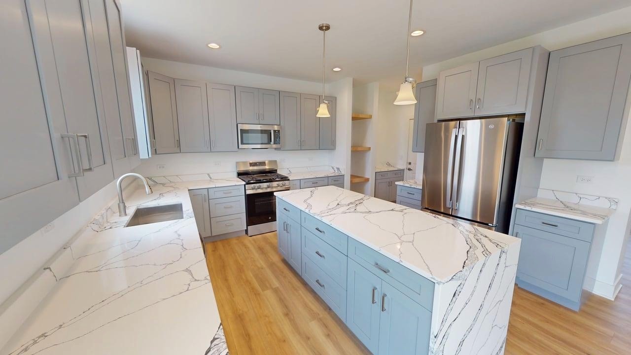 784 Cascade Place Marengo, IL 60152 - Photo 9 of 33 a large kitchen with stainless steel appliances granite countertop a sink a stove a refrigerator and a oven