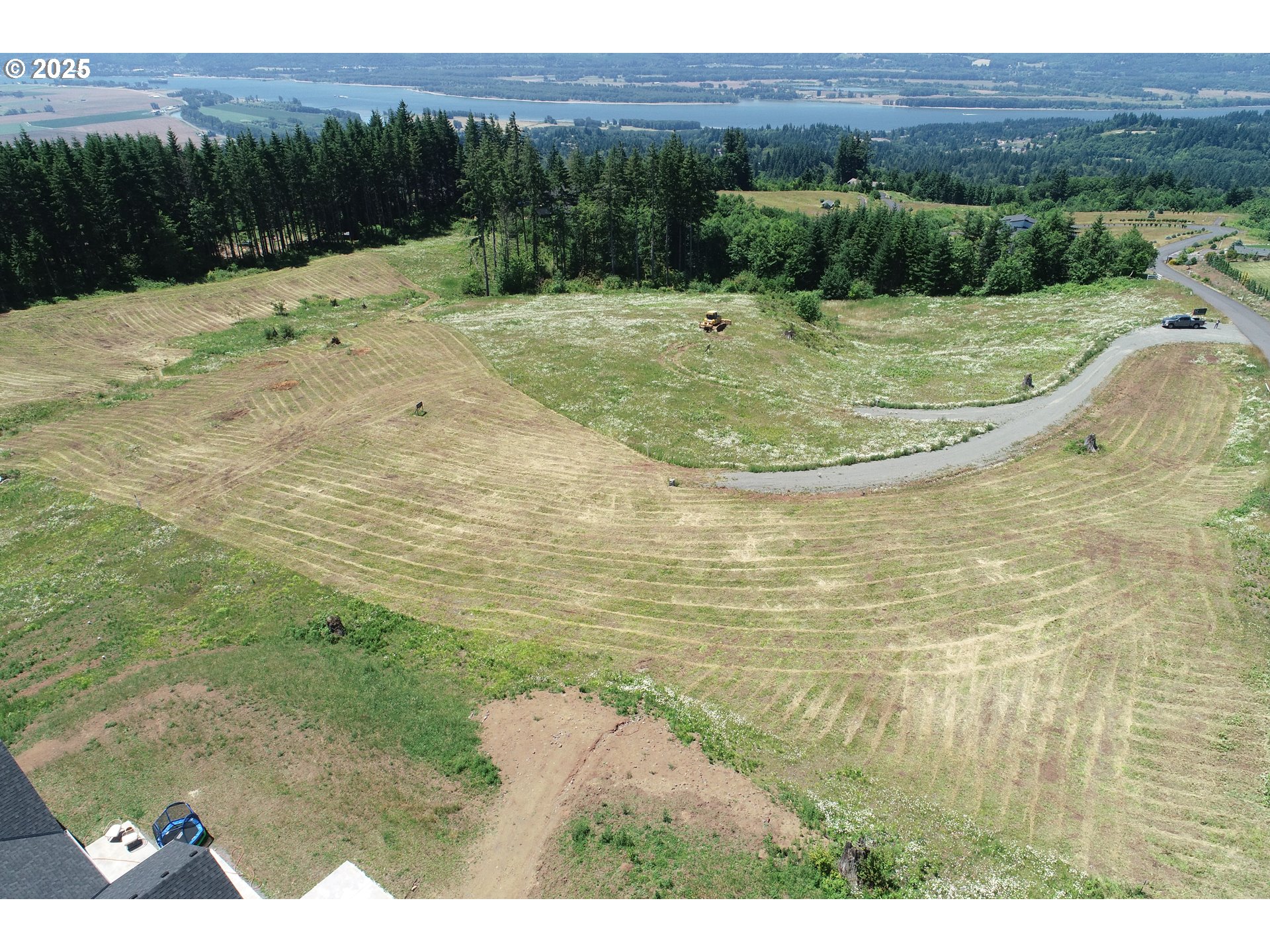 149 Resort Lane, Unit 1 Kalama, WA 98625 - Photo 2 of 12 a view of a dry yard with trees