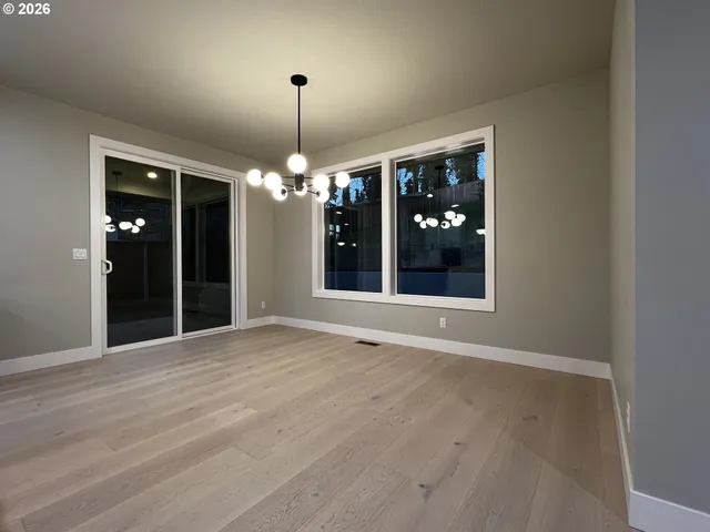 a view of an empty room and a window