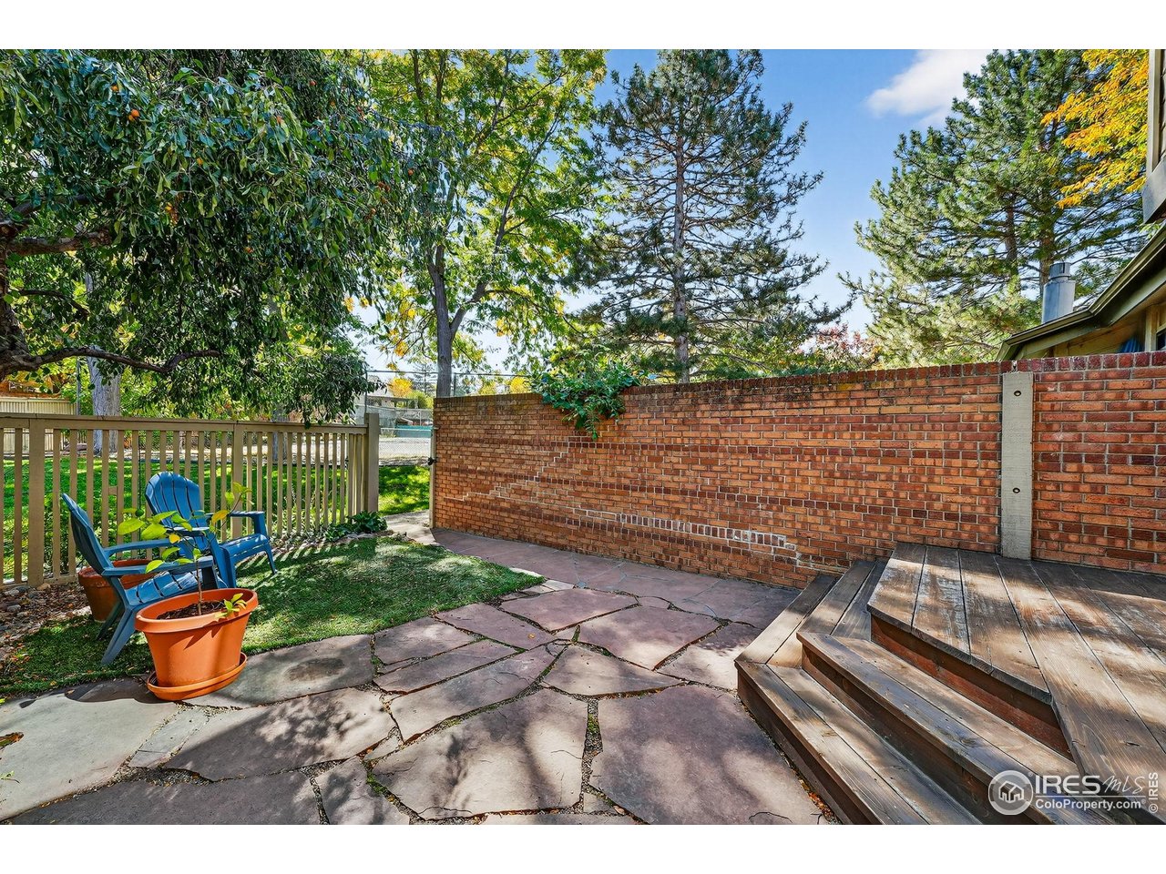 664 Quince Circle Boulder, CO 80304 - Photo 3 of 15 a view of a backyard with wooden fence