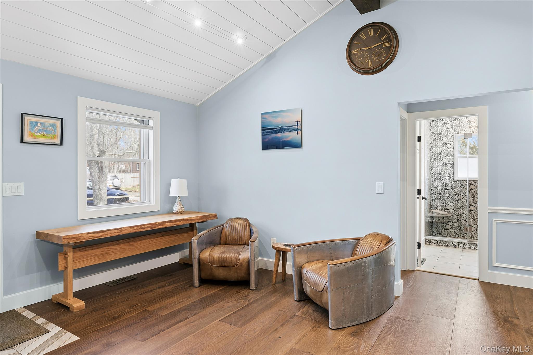 24 Woodridge Road Hampton Bays, NY 11946 - Photo 7 of 18 a living room with furniture and a window