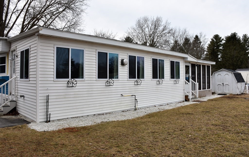 67 Breezy Lane Thompson, CT 06262 - Photo 15 of 17 a view of a house with a yard
