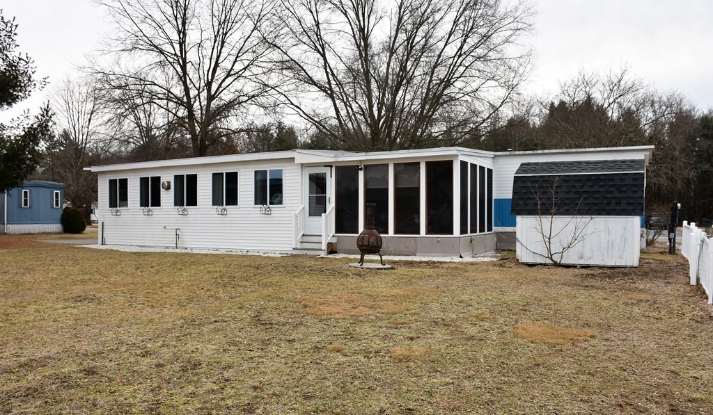 67 Breezy Lane Thompson, CT 06262 - Photo 16 of 17 a white house that has a tree in front of it
