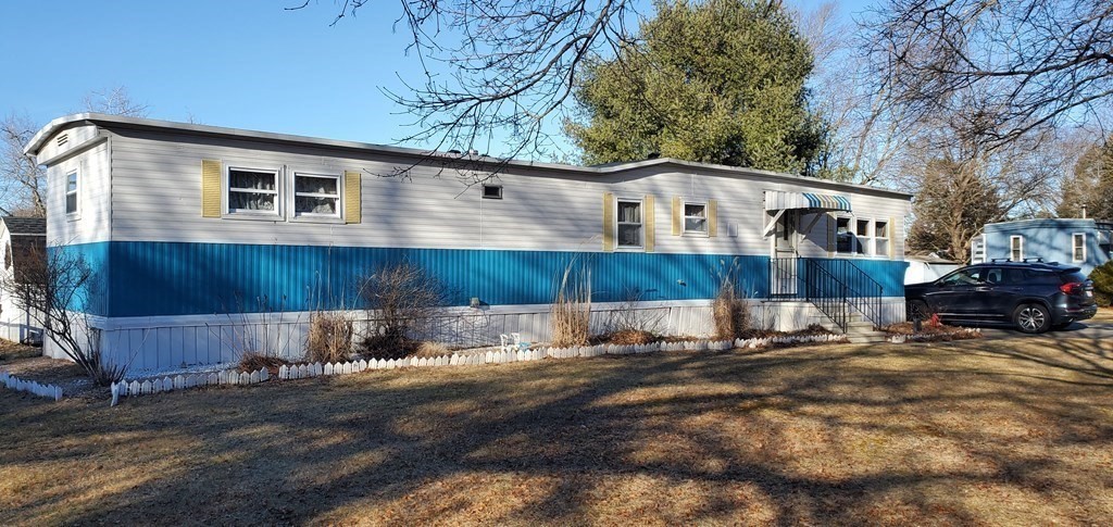 67 Breezy Lane Thompson, CT 06262 - Photo 3 of 17 a view of a house with a yard covered with snow in the background