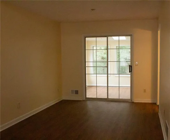 wooden floor and window in an empty room