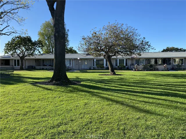 a view of a lawn with a swimming pool