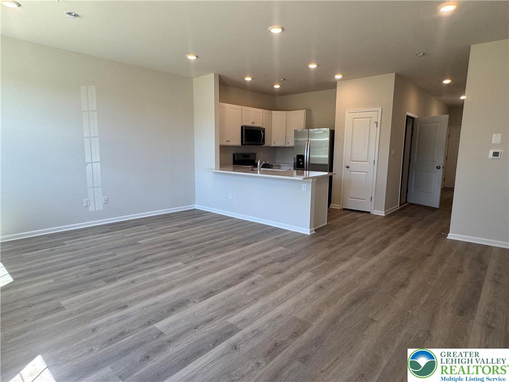1168 Martin Road Breinigsville, PA 18031 - Photo 11 of 11 An open floorplan seamlessly connects the living area with a well-appointed kitchen.