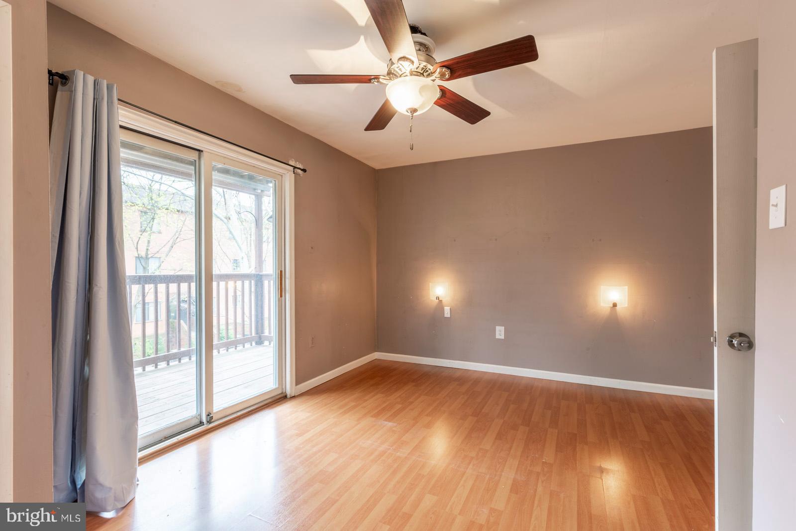 1120 Rodman Street, Unit 2 Philadelphia, PA 19147 - Photo 11 of 18 a view of an empty room with wooden floor and a window