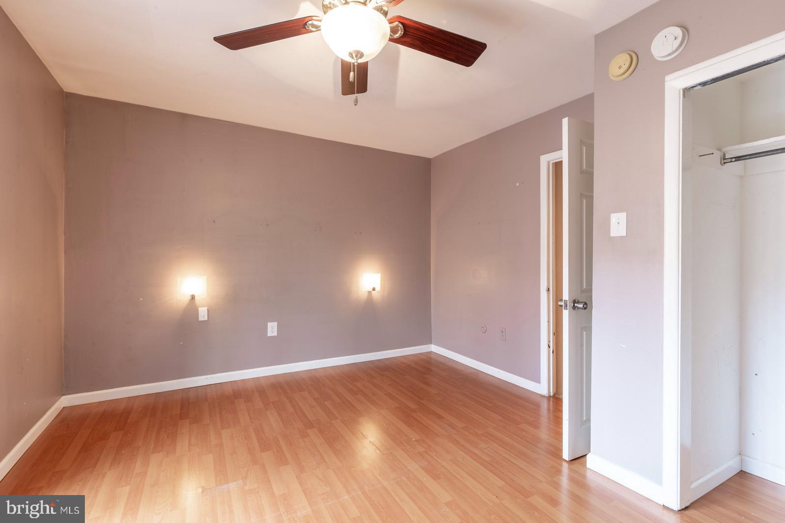 1120 Rodman Street, Unit 2 Philadelphia, PA 19147 - Photo 12 of 18 an empty room with wooden floor and windows